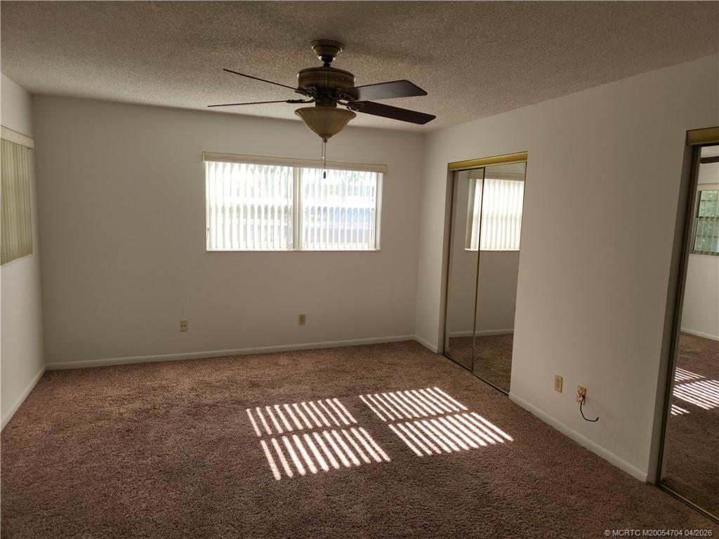 2950 Southeast Ocean Boulevard, Unit 311 Stuart, FL 34996 - Photo 12 of 16 a view of an empty room and window