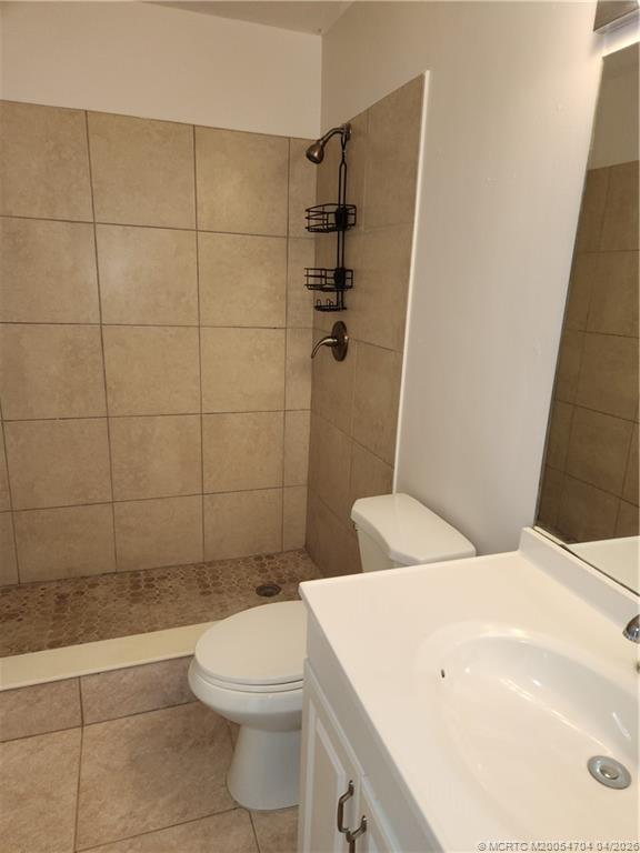 2950 Southeast Ocean Boulevard, Unit 311 Stuart, FL 34996 - Photo 14 of 16 a bathroom with a sink a toilet and shower