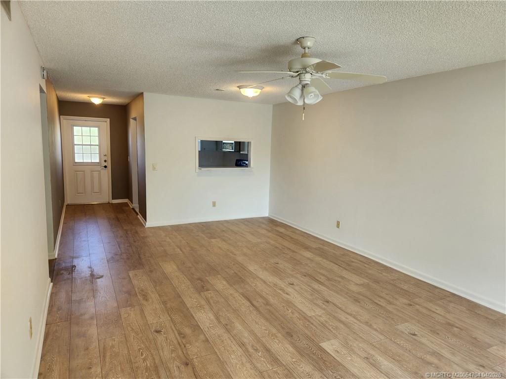 2950 Southeast Ocean Boulevard, Unit 311 Stuart, FL 34996 - Photo 7 of 16 a view of a livingroom with wooden floor