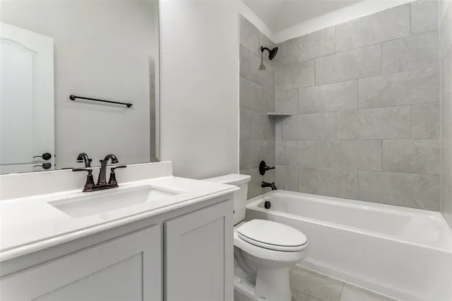 a bathroom with a sink a toilet and a bathtub