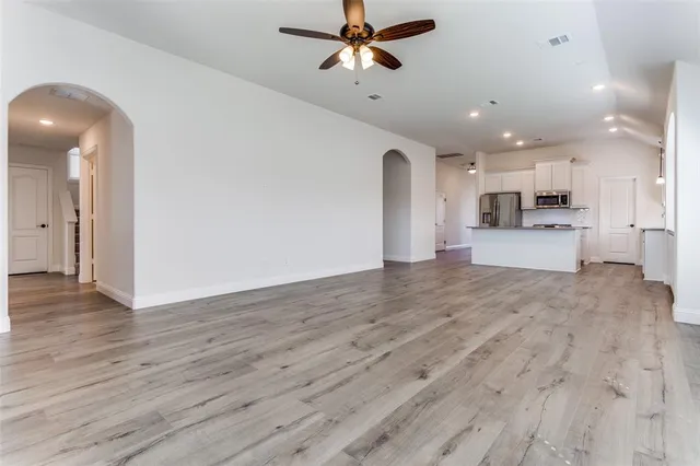 a view of a kitchen and wooden floor