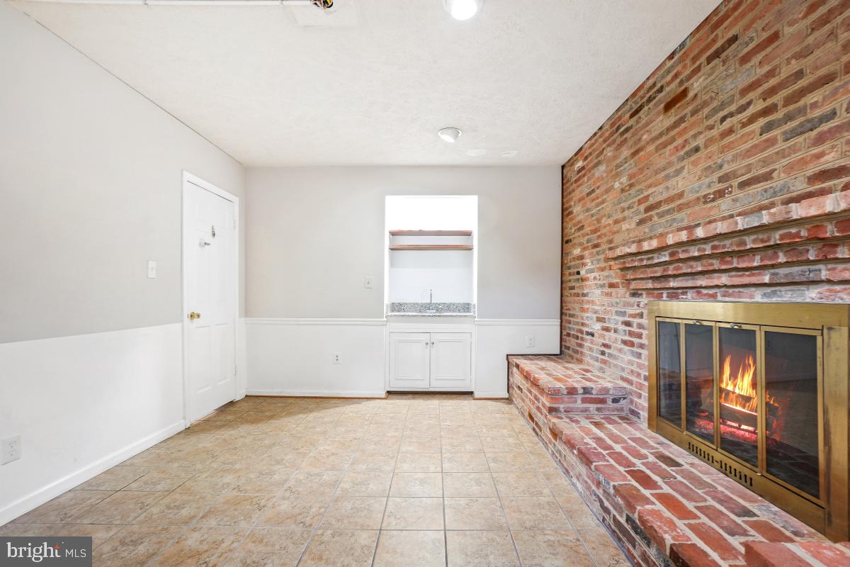 6871 Churchill Road McLean, VA 22101 - Photo 24 of 30 a living room with furniture and a fireplace