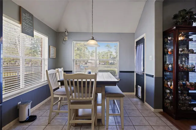 a view of a dining room with furniture window and outside view