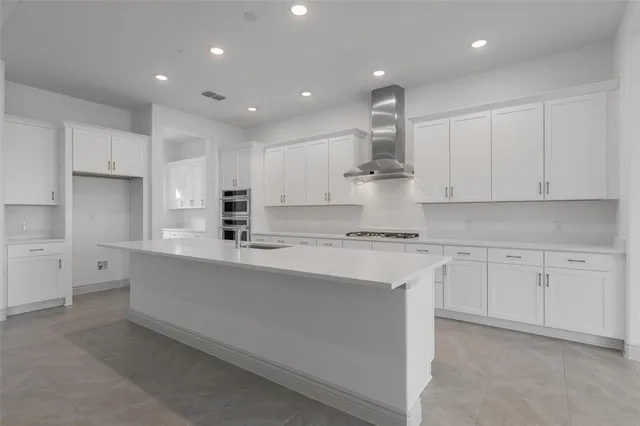 an empty room with window and wooden floor