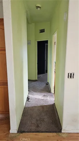 a view of a room that has a window in it