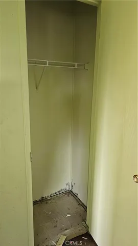 a bathroom with a granite countertop sink mirror vanity and toilet