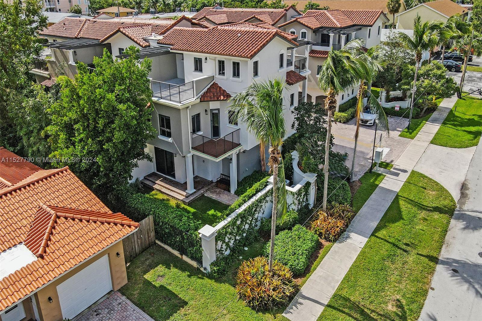 Ocean Vue Deerfield Beach, FL 33441 - Photo 19 of 93 a aerial view of a house with a yard and potted plants