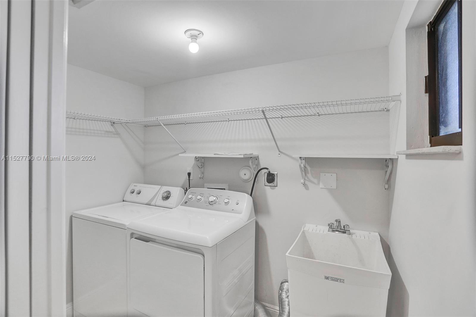 Ocean Vue Deerfield Beach, FL 33441 - Photo 24 of 93 a utility room with dryer and washer