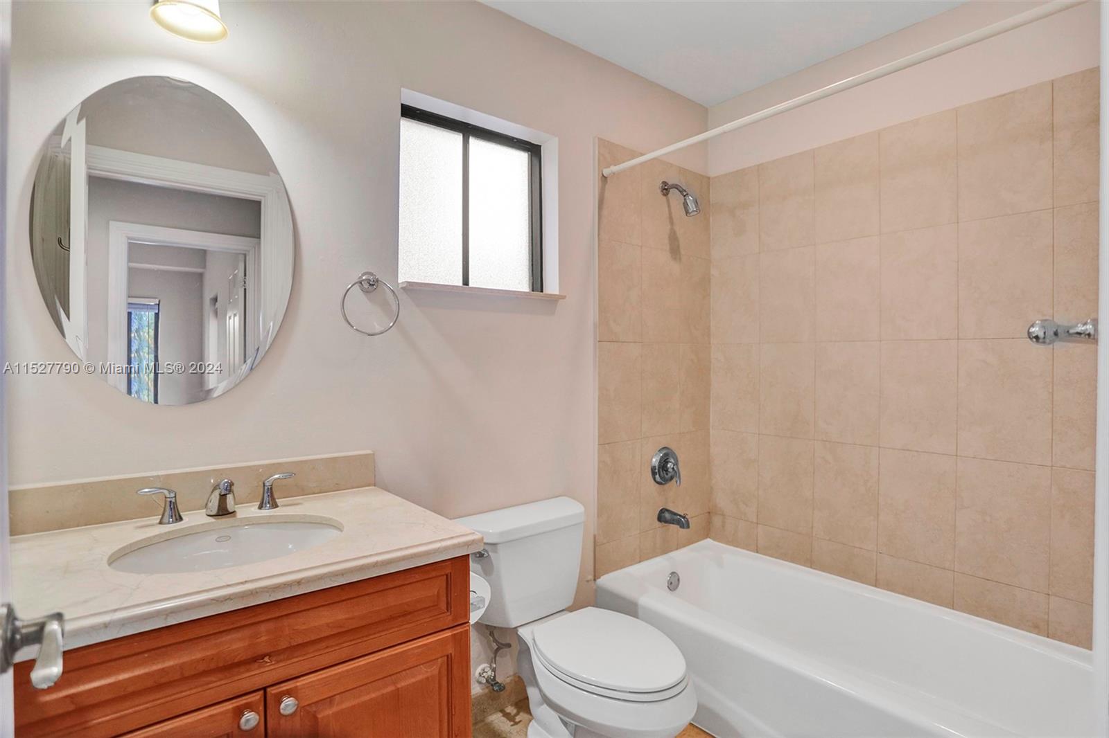 Ocean Vue Deerfield Beach, FL 33441 - Photo 45 of 93 a bathroom with a granite countertop sink toilet a mirror and shower