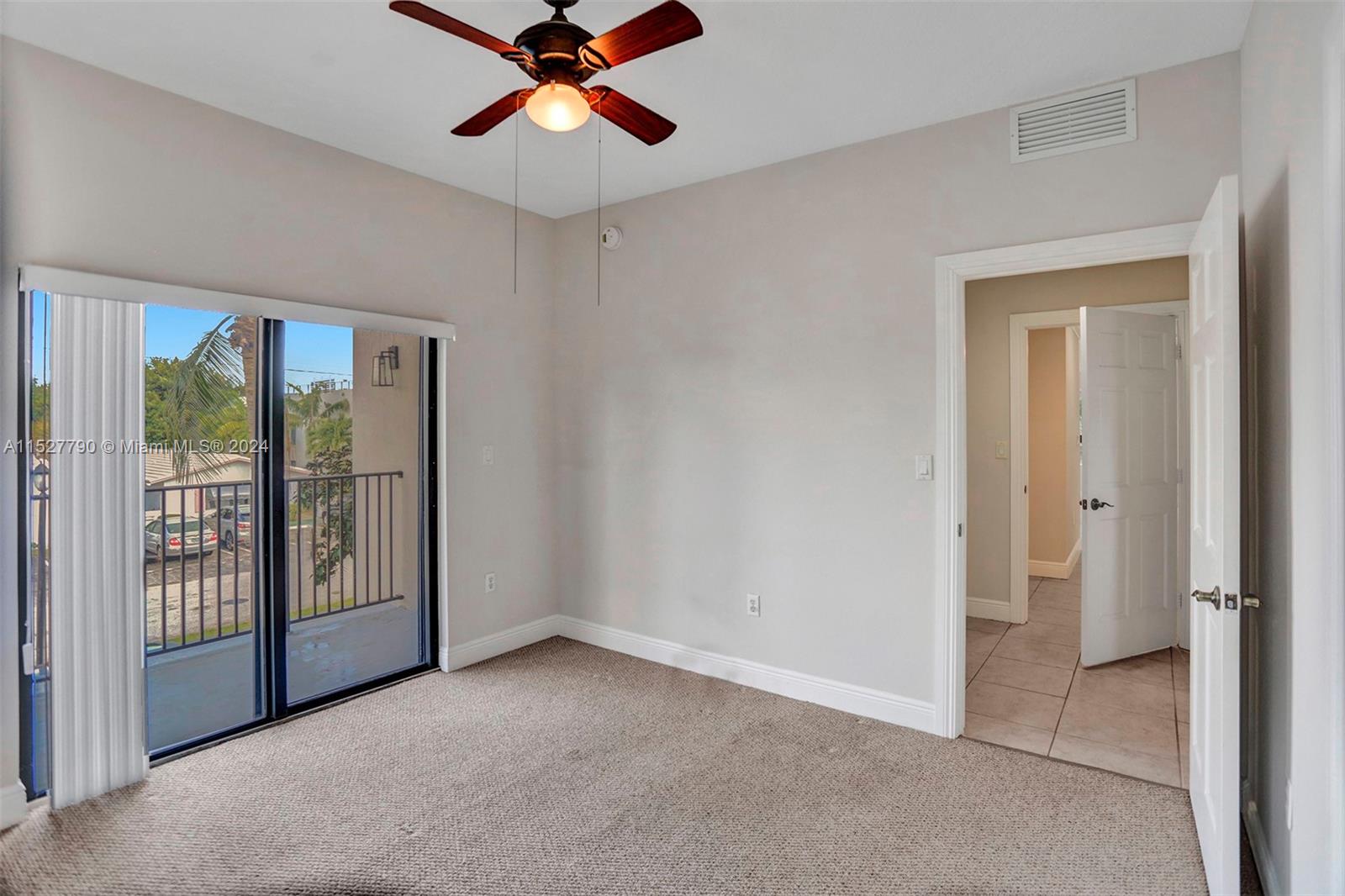 Ocean Vue Deerfield Beach, FL 33441 - Photo 50 of 93 a view of an empty room with window and a ceiling fan