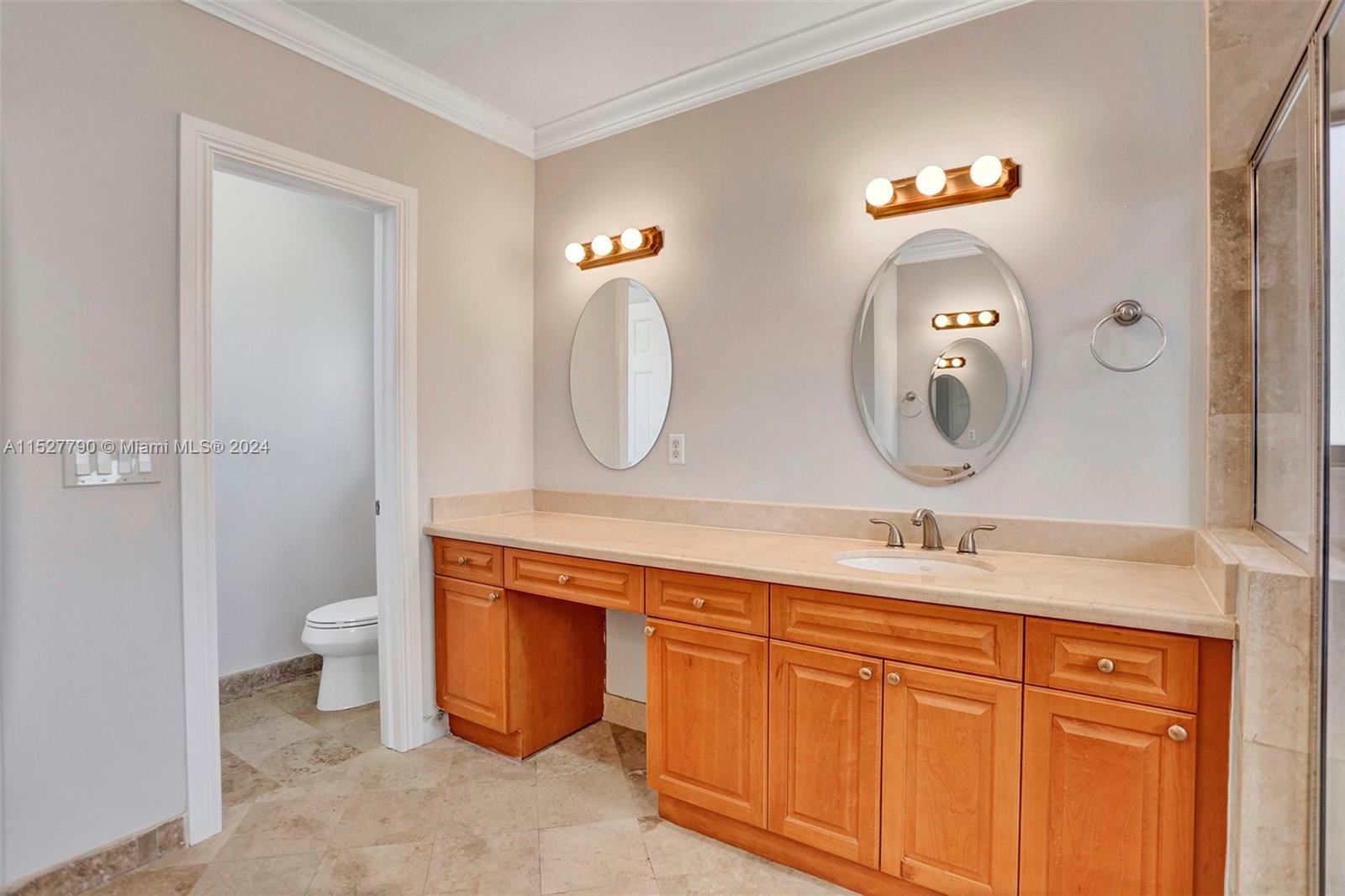 Ocean Vue Deerfield Beach, FL 33441 - Photo 66 of 93 a bathroom with a double vanity sink and a mirror