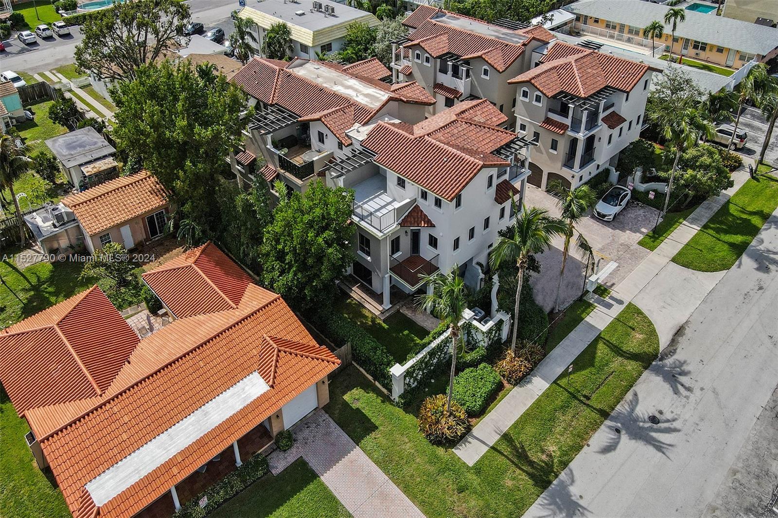 Ocean Vue Deerfield Beach, FL 33441 - Photo 8 of 93 an aerial view of a house with a garden