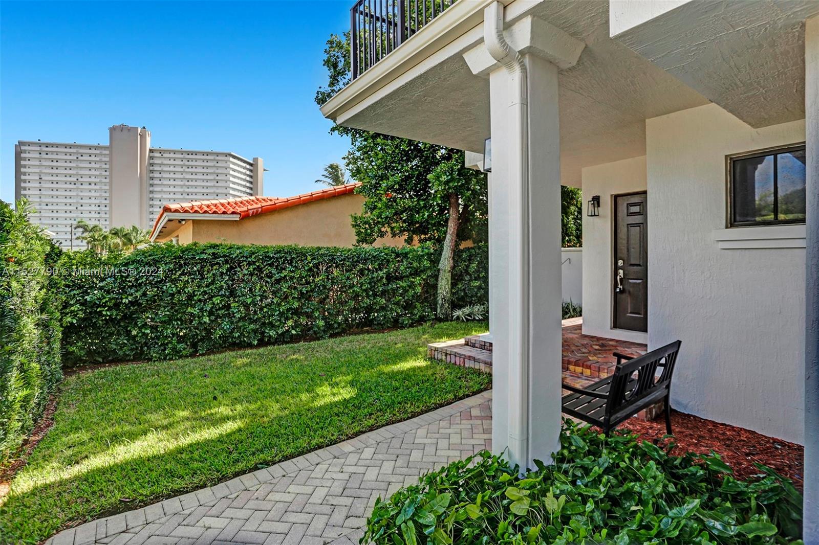 Ocean Vue Deerfield Beach, FL 33441 - Photo 89 of 93 a backyard view of a house with a garden and patio