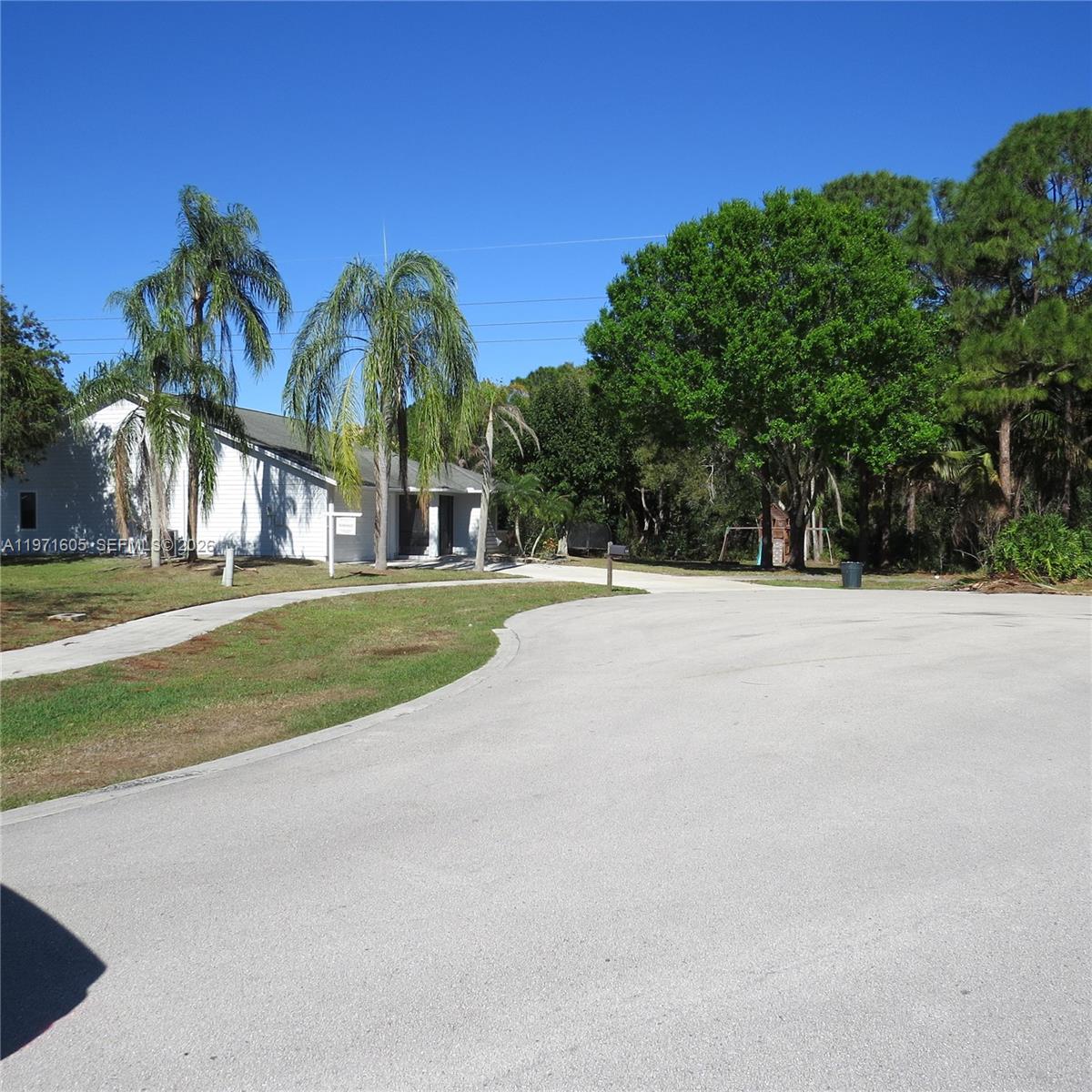 6883 Southeast Raintree Avenue Stuart, FL 34997 - Photo 23 of 32 a view of outdoor space with garden
