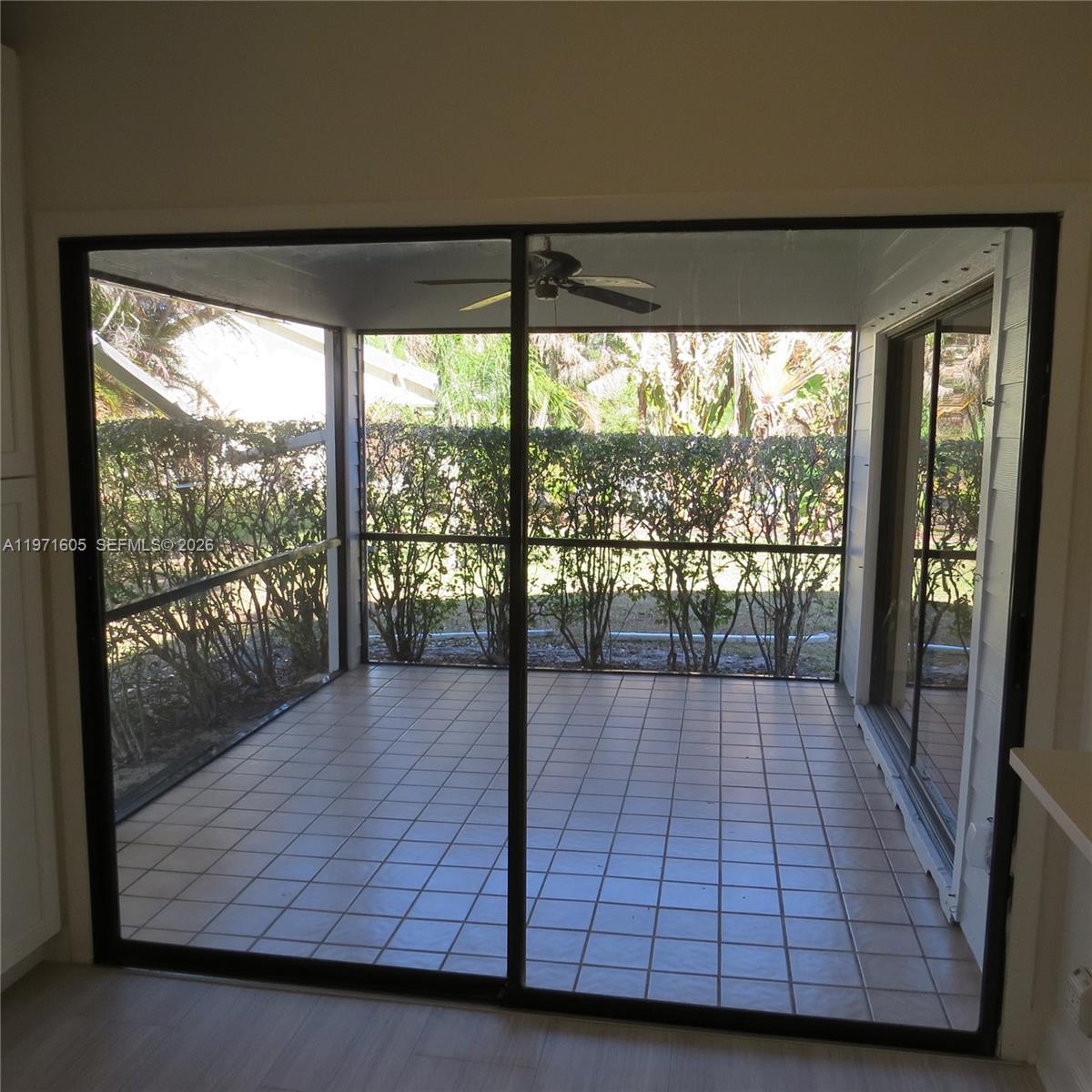 6883 Southeast Raintree Avenue Stuart, FL 34997 - Photo 10 of 32 a living room with a large window