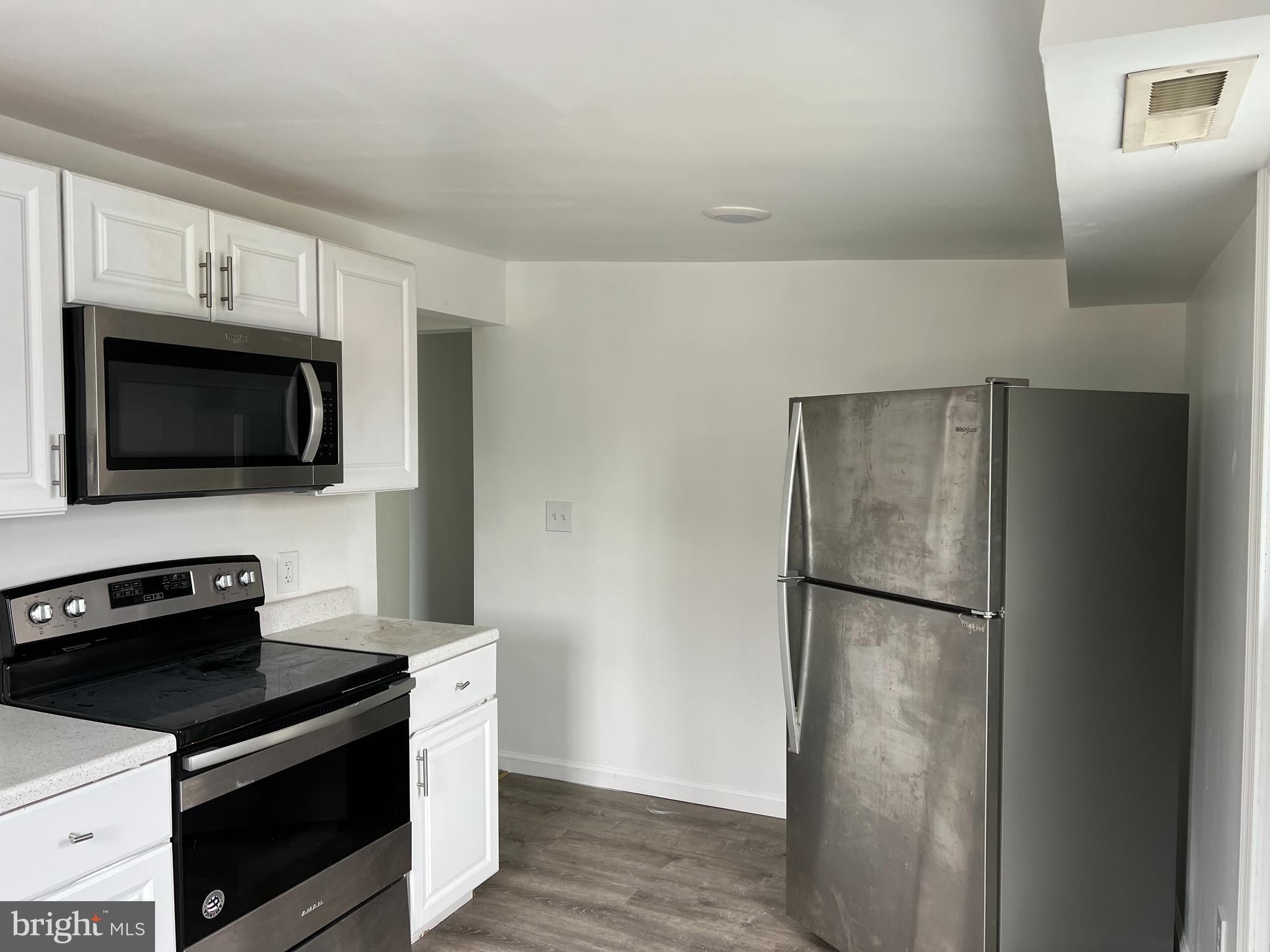 3554 Lincoln Highway East Thorndale, PA 19372 - Photo 1 of 6 a kitchen with a refrigerator stove and microwave