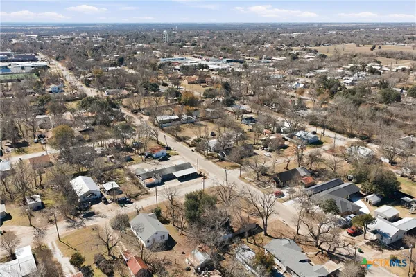 an aerial view of residential building and ocean view