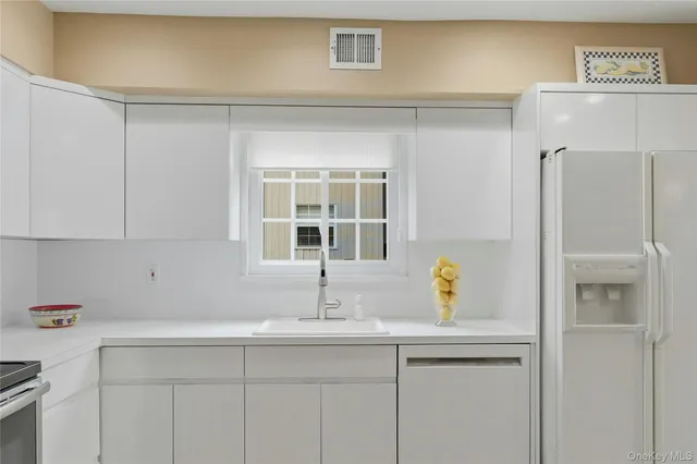 a kitchen with a stove and a refrigerator