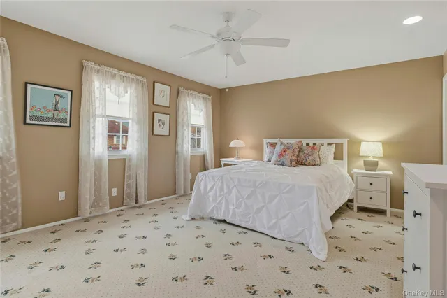 a bedroom with a large bed and closet