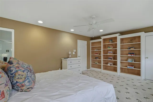 a bathroom with a granite countertop sink toilet a mirror and shower
