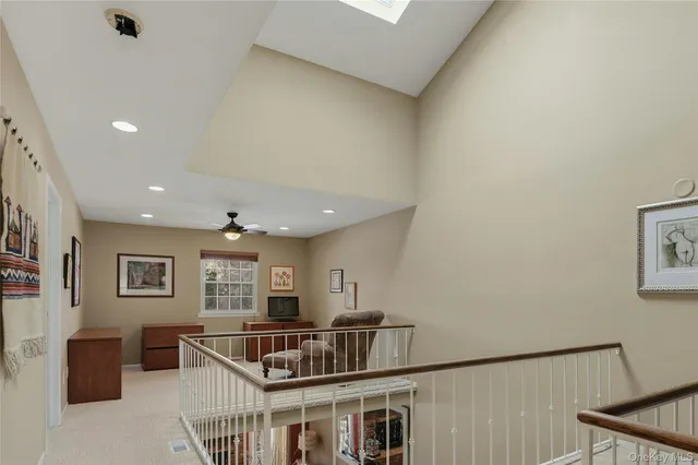 a bathroom with a granite countertop sink a toilet and a mirror