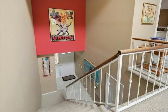 a view of a patio with a table and chairs under an umbrella