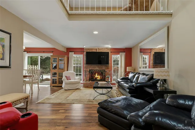 a living room with furniture and a book shelf