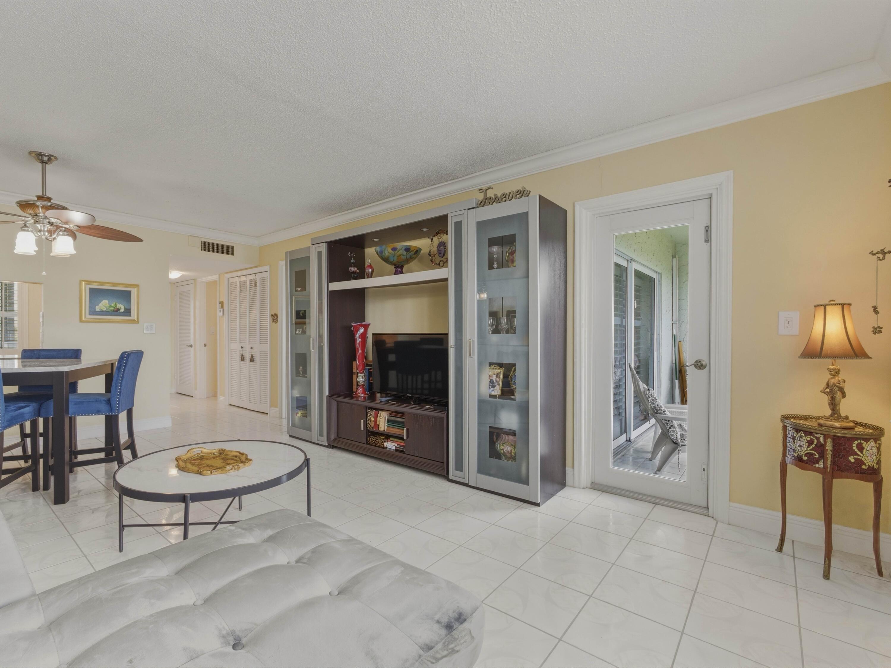 9810 Marina Boulevard, Unit 1136 Boca Raton, FL 33428 - Photo 11 of 35 a view of a livingroom with furniture and a couch