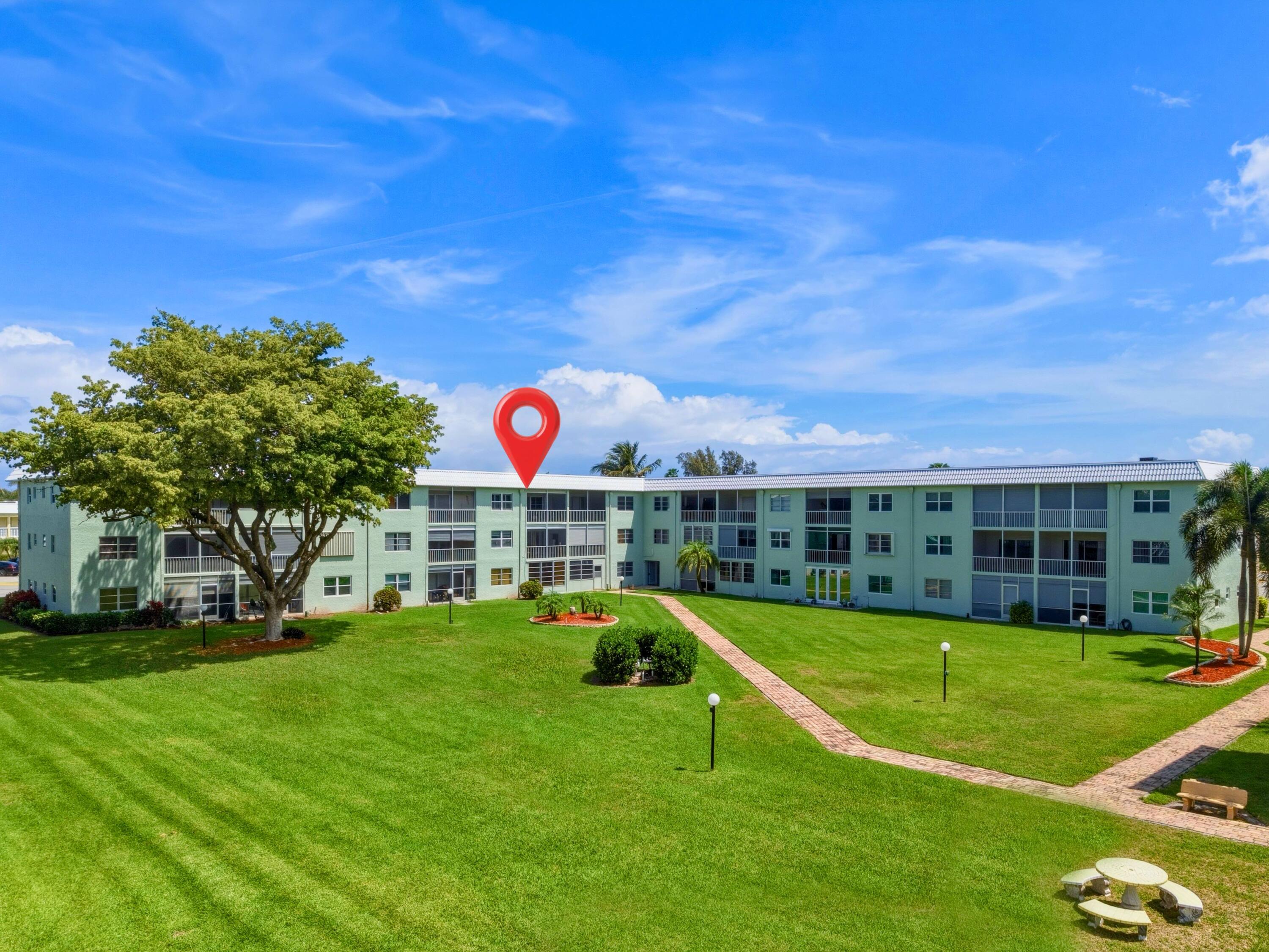 9810 Marina Boulevard, Unit 1136 Boca Raton, FL 33428 - Photo 21 of 35 a view of a house with a big yard