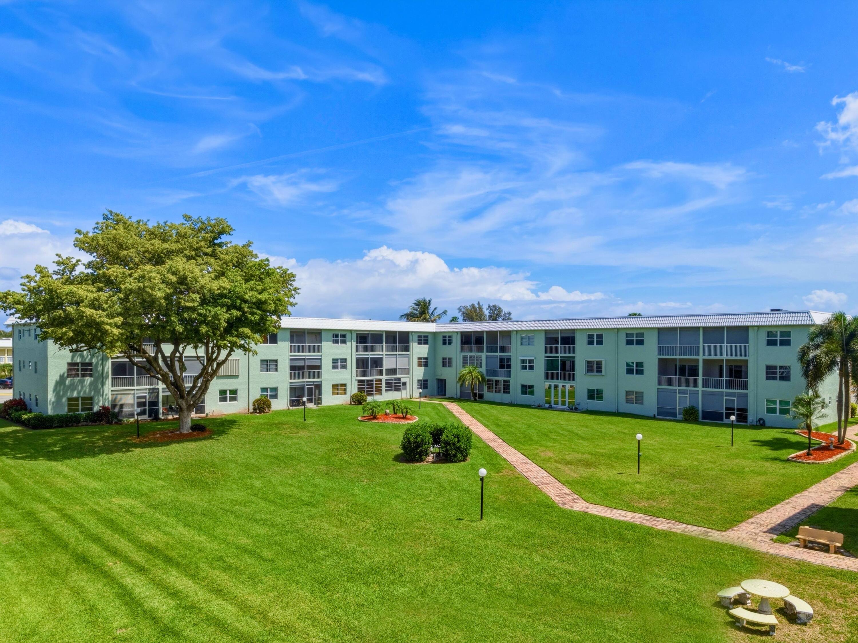 9810 Marina Boulevard, Unit 1136 Boca Raton, FL 33428 - Photo 23 of 35 a view of a house with a big yard