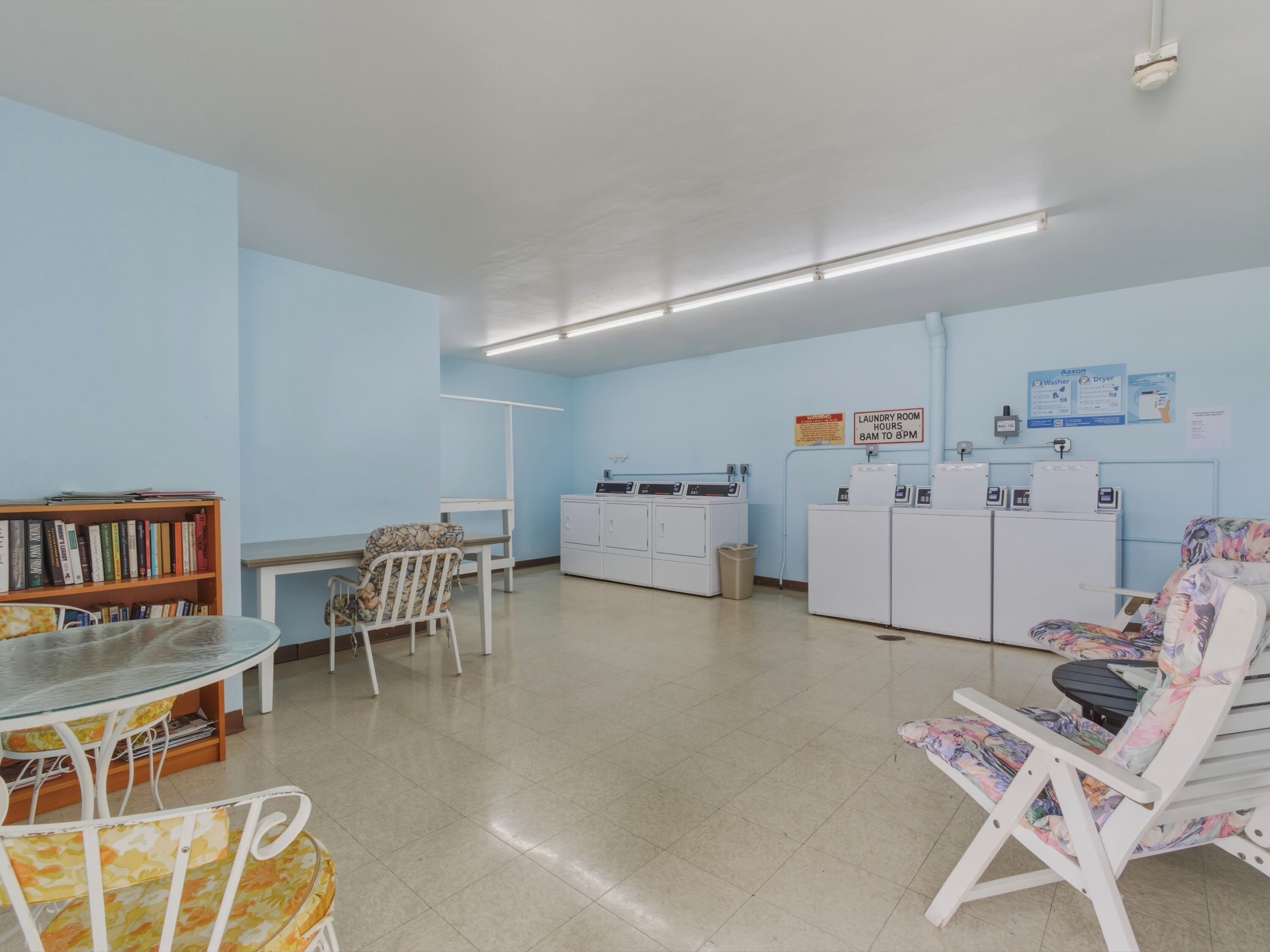 9810 Marina Boulevard, Unit 1136 Boca Raton, FL 33428 - Photo 26 of 35 a living room with furniture and a wooden floor