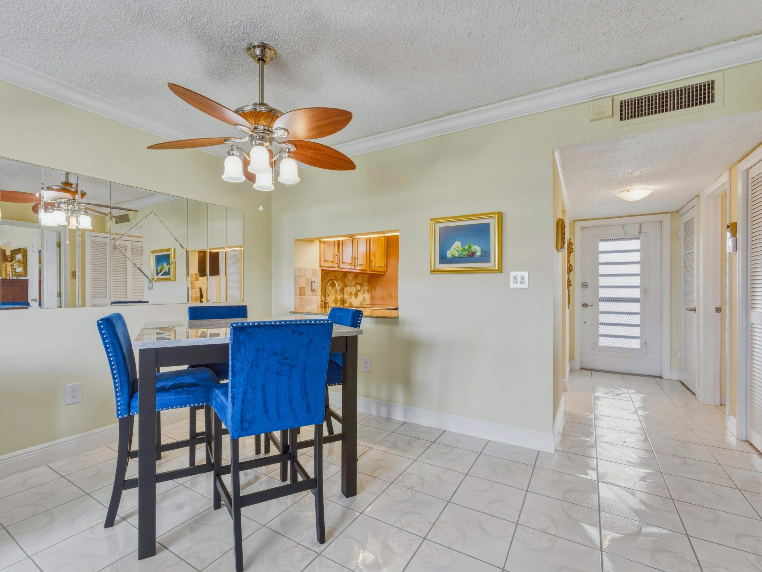 9810 Marina Boulevard, Unit 1136 Boca Raton, FL 33428 - Photo 6 of 35 a view of a dining room with furniture