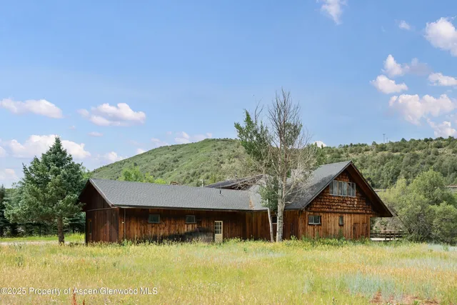 a house with swimming pool in front of it