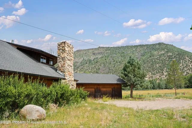 a view of a yard in front of a house with a yard