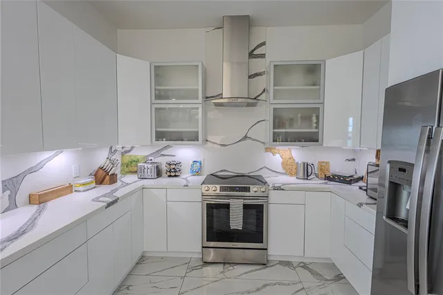 a hallway with a wooden floor and a large window