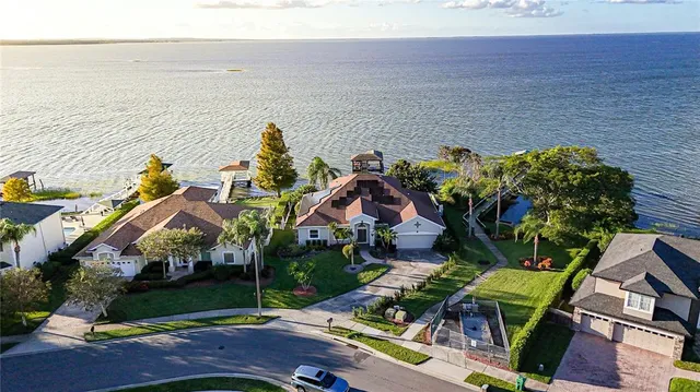 an aerial view of houses with yard