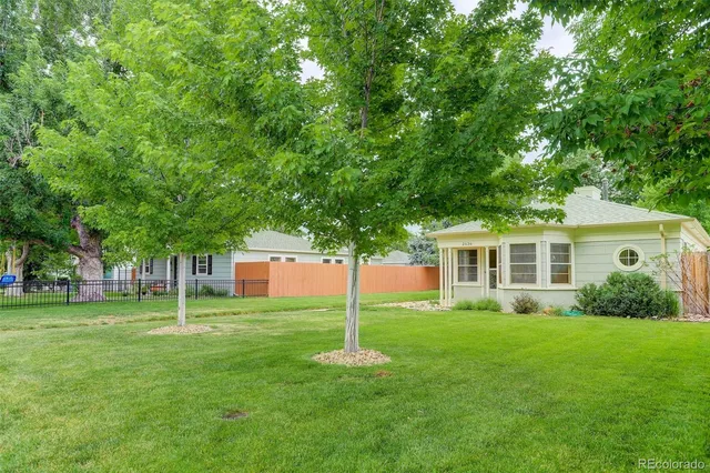 a house view with a sitting space and garden