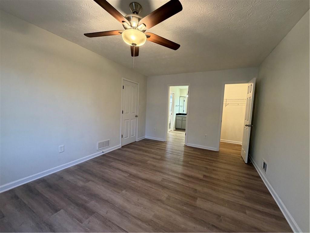 3056 Mill Falls Court Duluth, GA 30097 - Photo 19 of 31 an empty room with wooden floor and windows