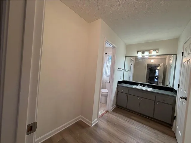 a view of a double vanity sink and mirror in bathroom