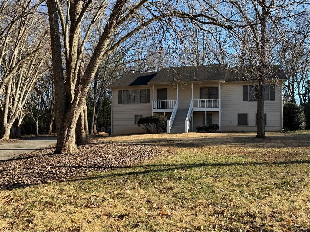 3056 Mill Falls Court Duluth, GA 30097 - Photo 2 of 31 a front view of a house with a yard