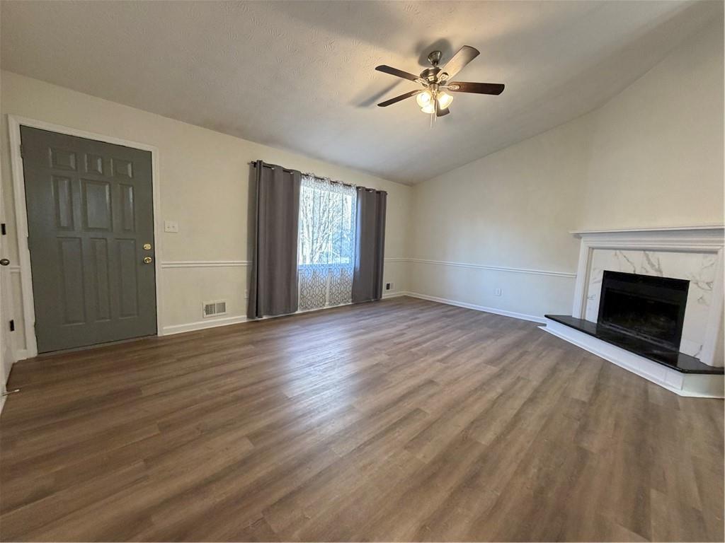 3056 Mill Falls Court Duluth, GA 30097 - Photo 7 of 31 a view of empty room with wooden floor and fan