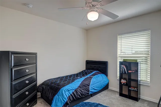 a bedroom with a bed and closet