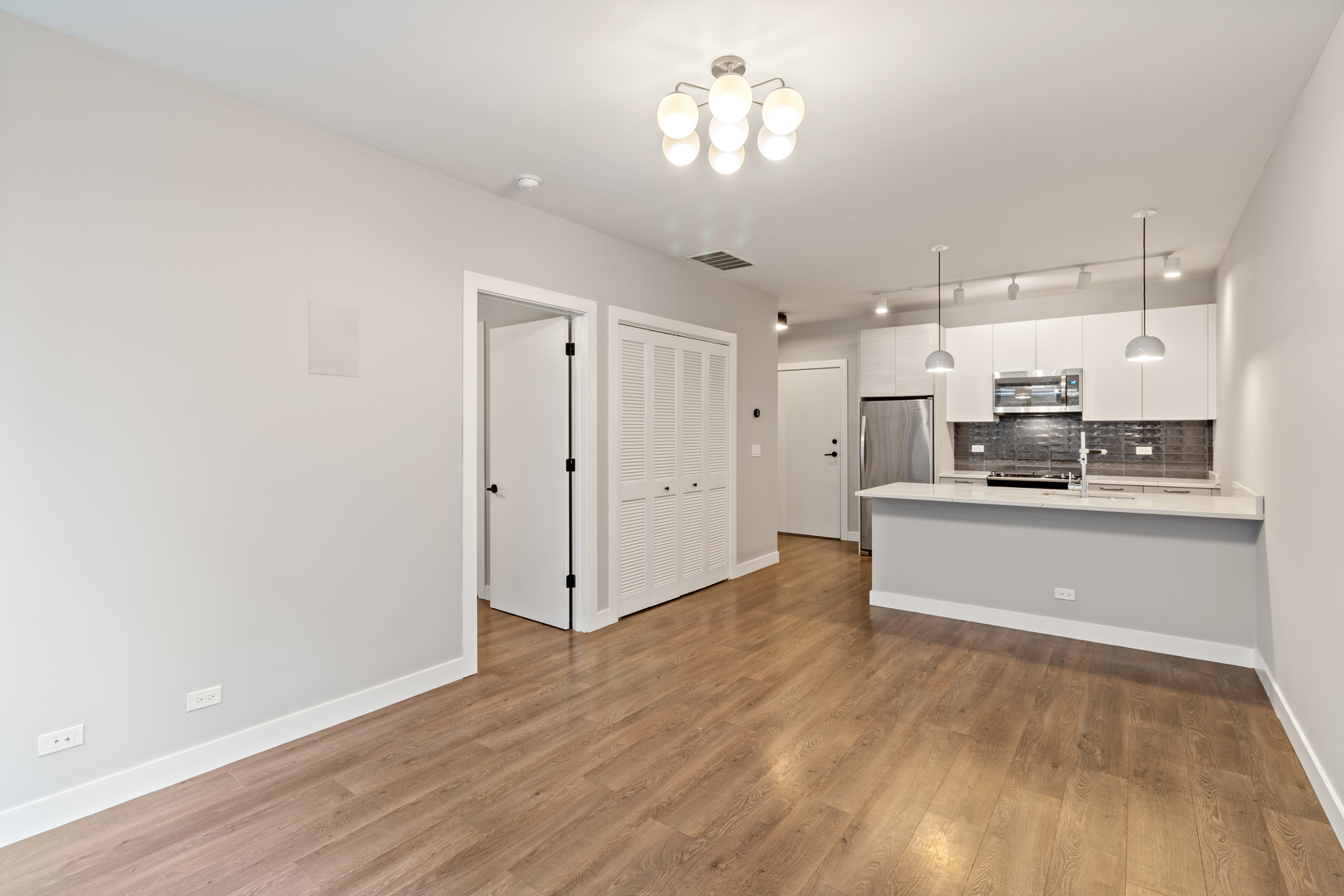Undisclosed Address Chicago, IL 60610 - Photo 2 of 13 a view of a kitchen with a refrigerator and a stove top oven