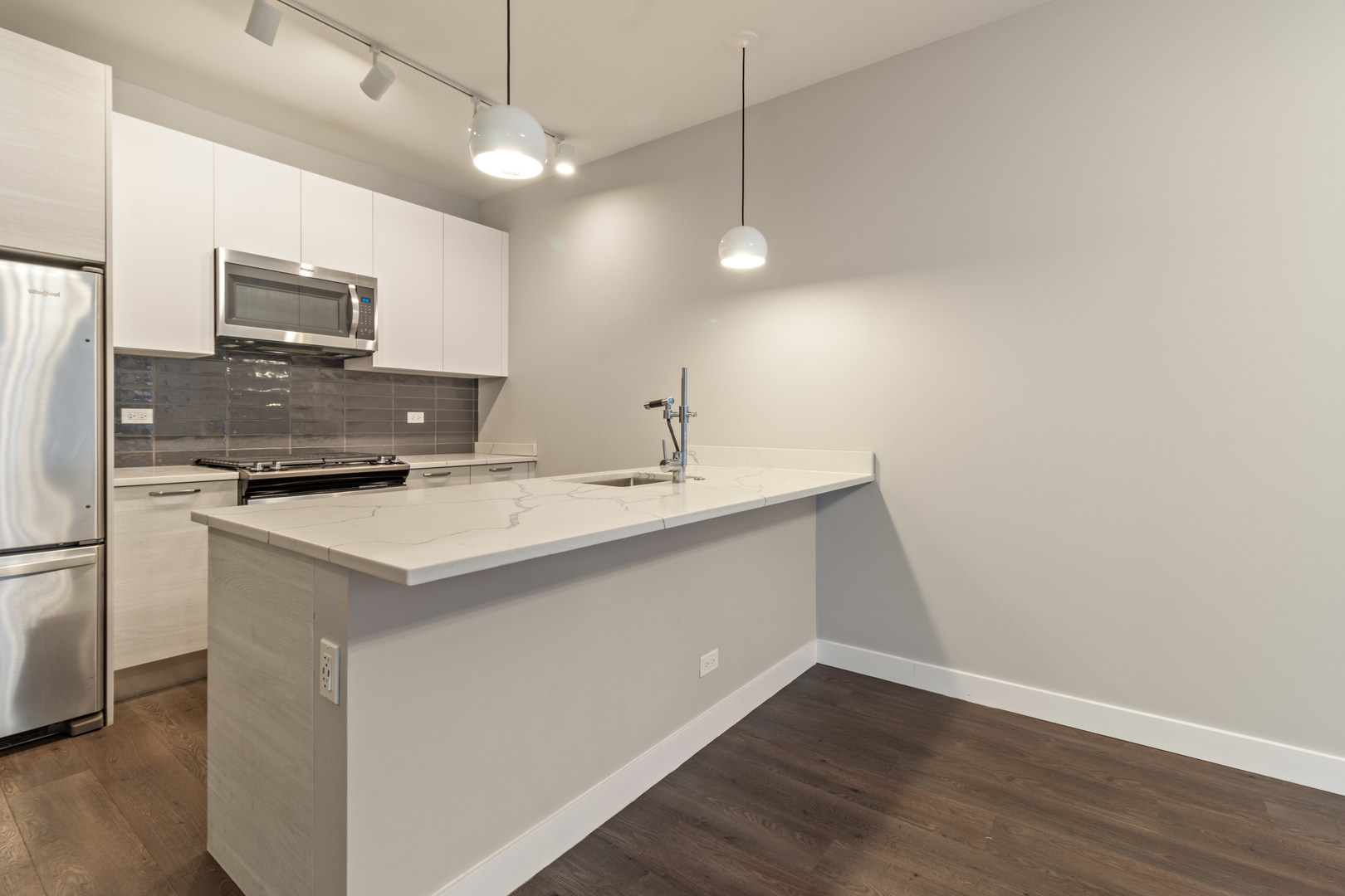 Undisclosed Address Chicago, IL 60610 - Photo 3 of 13 a kitchen with a sink a counter space appliances and cabinets