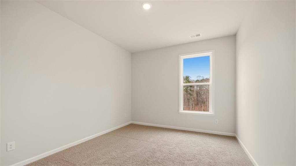 1780 Goodwin Drive Hampton, GA 30228 - Photo 18 of 40 a view of an empty room with a window