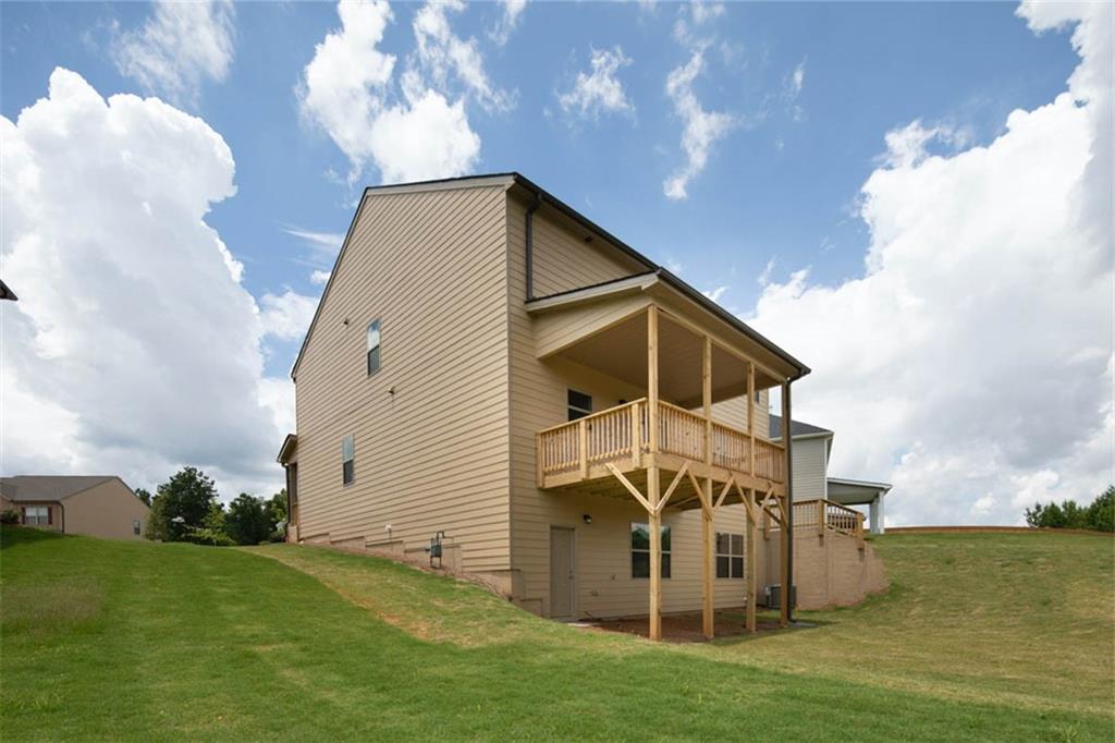 1780 Goodwin Drive Hampton, GA 30228 - Photo 19 of 40 a view of a house with a yard
