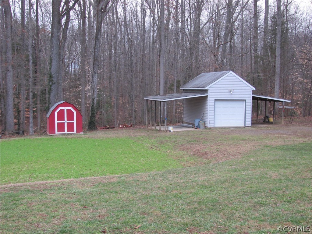 16160 Tyler Station Road Beaverdam, VA 23015 - Photo 16 of 17 a front view of a house with garden