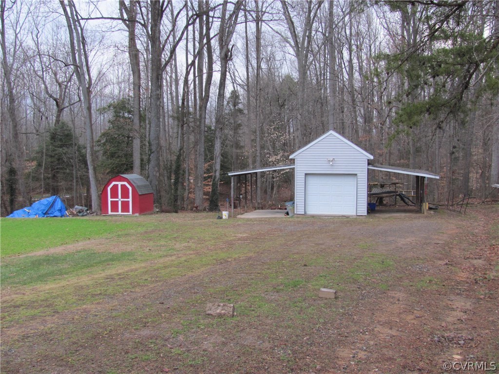 16160 Tyler Station Road Beaverdam, VA 23015 - Photo 17 of 17 a front view of a house with a yard and garage