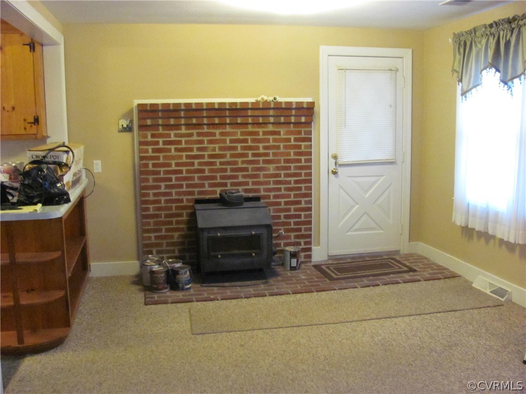 16160 Tyler Station Road Beaverdam, VA 23015 - Photo 5 of 17 a view of an empty room and fire place