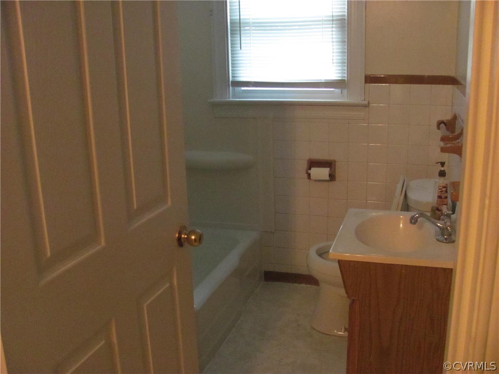 16160 Tyler Station Road Beaverdam, VA 23015 - Photo 10 of 17 a bathroom with a sink a toilet and shower